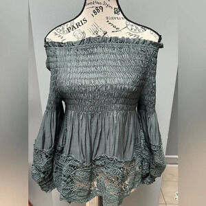 Solution. Turquoise romantic off the shoulder blouse.   Size medium.